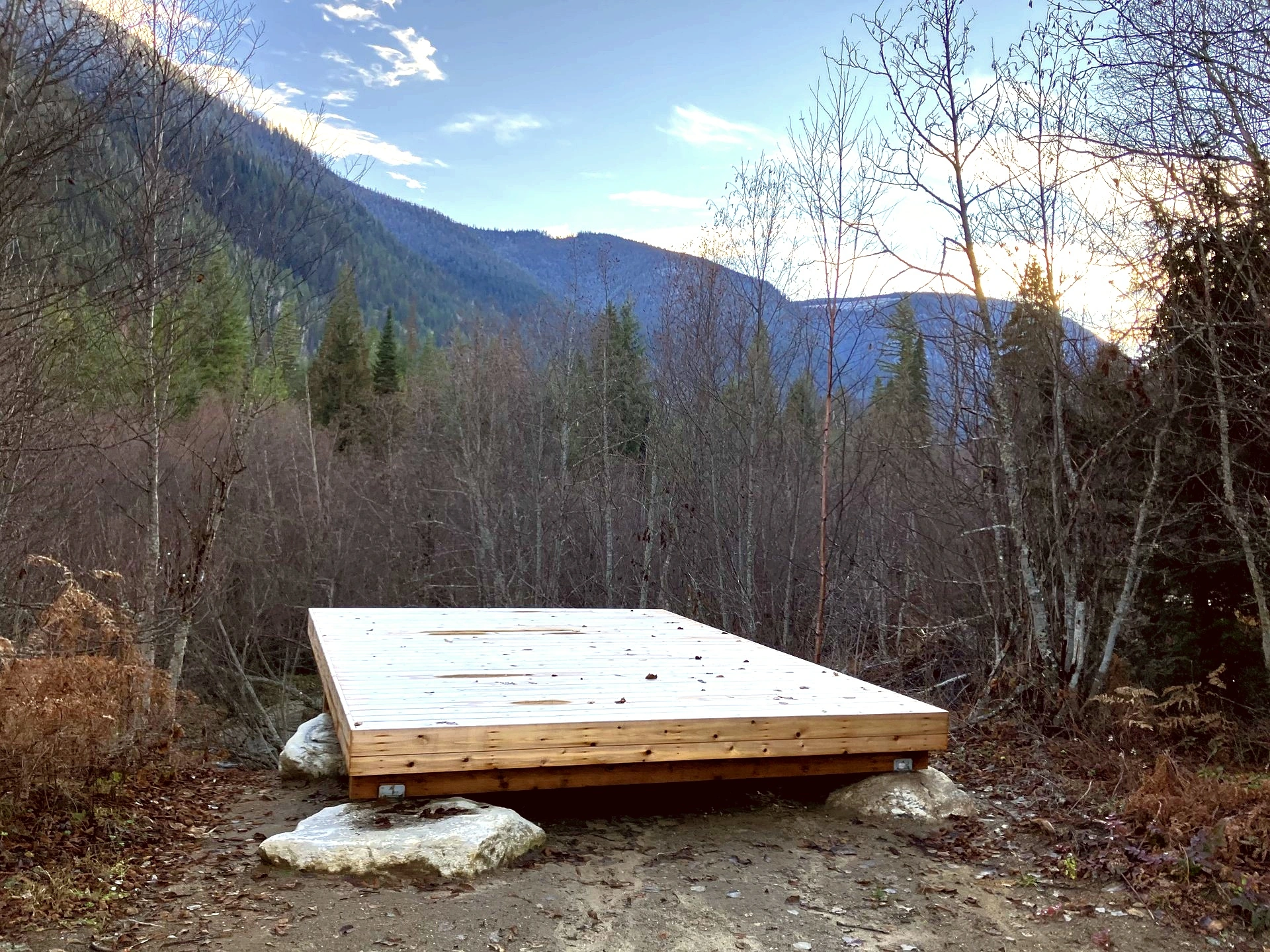 Tent camping sites surrounded by forest at Little Camp Slocan
